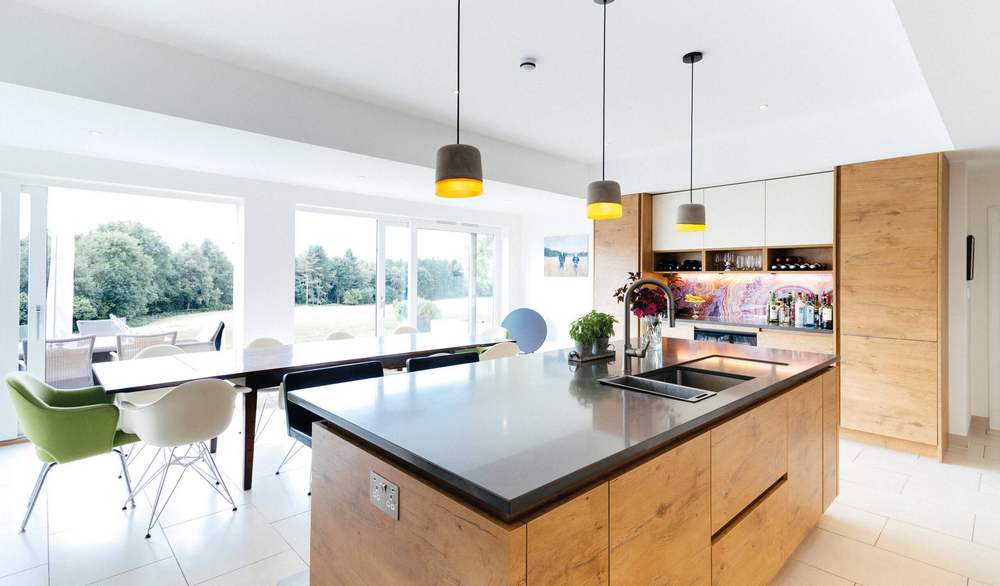 Rotpunkt & Bespoke Wood Look and White Chrome Handled Kitchen and Matching Rotpunkt Island – Miele Neff Liebherr Appliances – Caesarstone Worktops