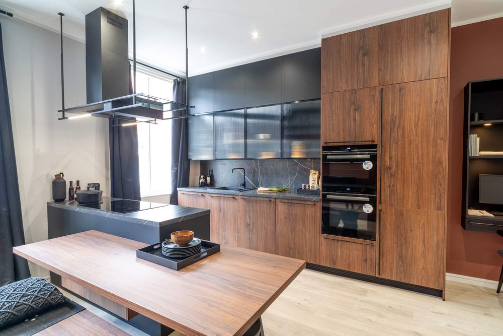 Ex Display Hacker Concept Bali Walnut Soft Black Kitchen & Peninsular with Sideboard – Blaupunkt Appliances - AP130 Marble effect Anthracite Worktops & Splashback Bali Walnut effect low Breakfast Bar & Bench